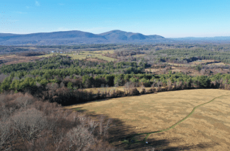 view from above of Fields situated along Cooper Hill in proximity to the Taconic Range that borders Sheffield MA